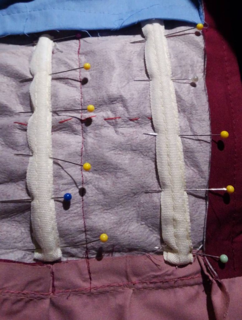 Plastic boning pinned into an obi