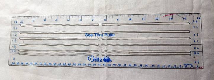 A tailor's ruler, showing common measurements and widths