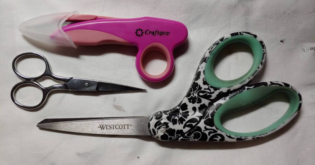 Several types of scissors. Thread scissors, embroidery scissors, and fabric scissors.