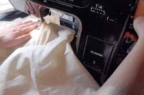 A gif showing how to wrangle bulky fabric