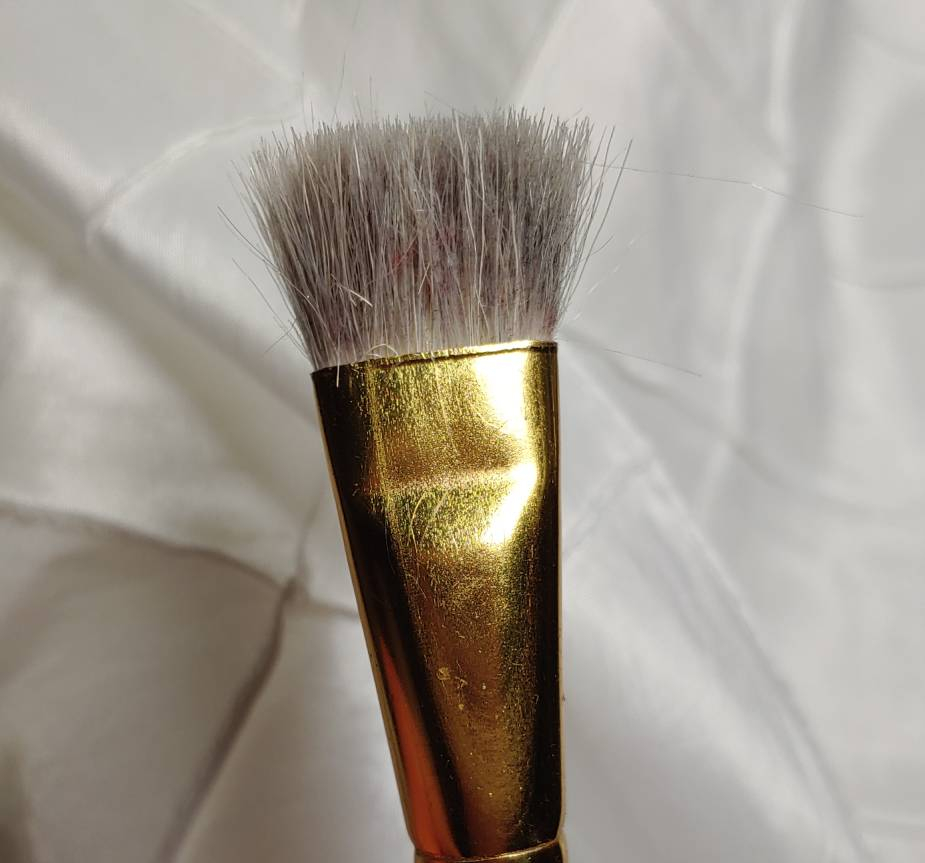 A dusting brush which is really just an old fluffy paintbrush used exclusively for cleaning my machine