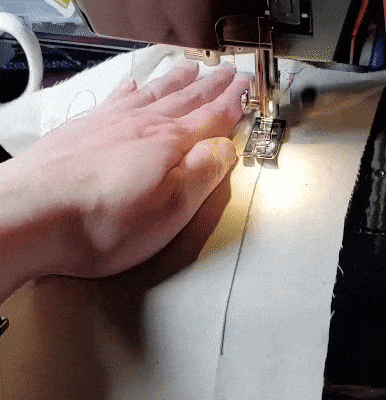 Gif showing how to guide the fabric in a straight line
