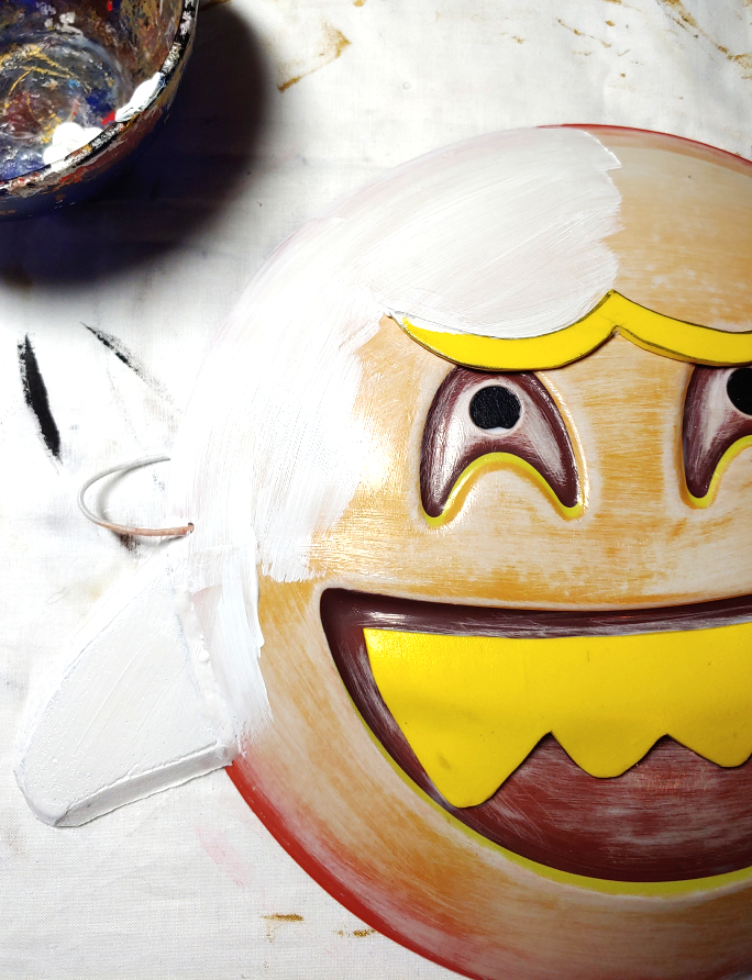 Painting the base coat completely white to make the mask look more plasticky