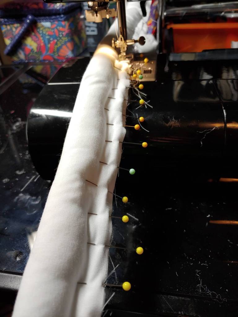 A stuffed noodle pinned to make sewing easier.