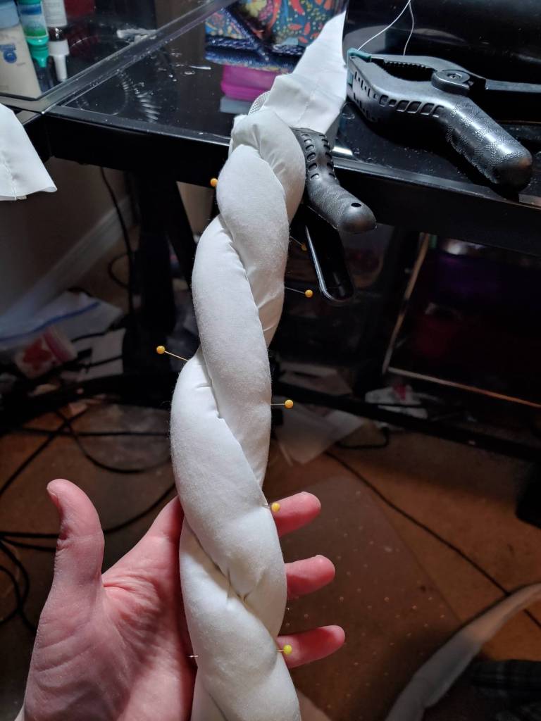 Rope being twisted and pinned together.