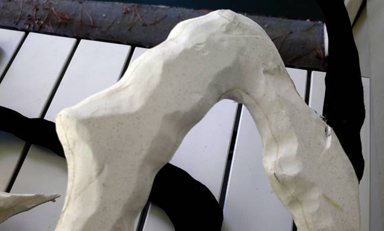 A branch beat up irregularly with a dremel