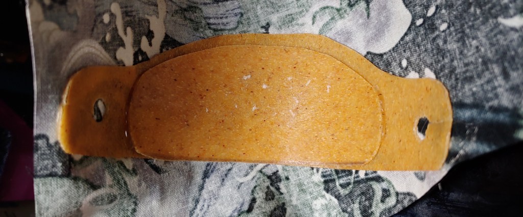 Ornament glued to the outside fabric