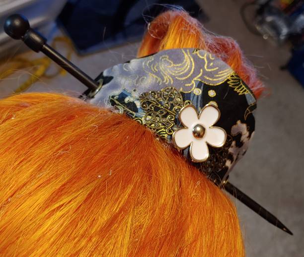 finished hair ornament with flower accent