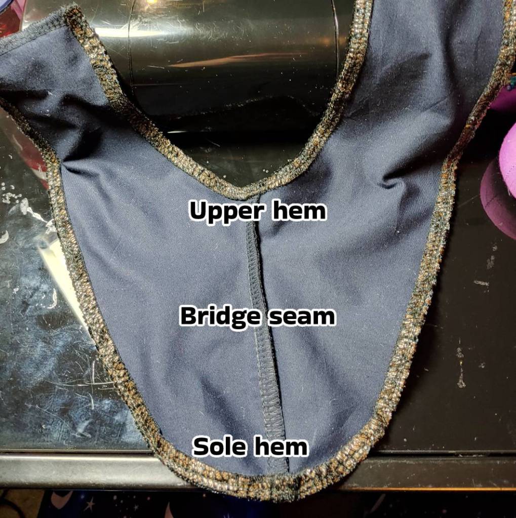 inside of the front of the shoe sewing the upper and lower hems plus the bridge seam