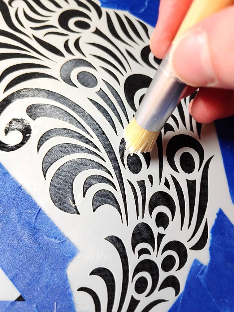 Rubbing the paint in with a stencil brush