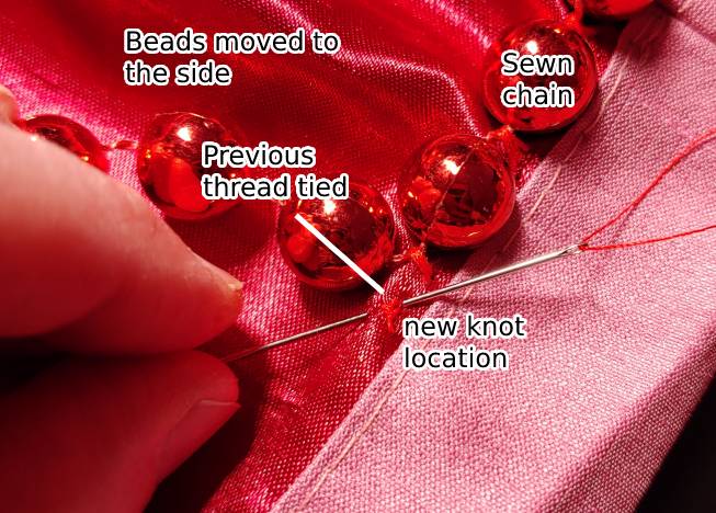 How to hide the knot underneath a bead