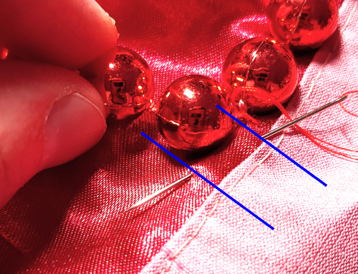 A straight stitch underneath the beads