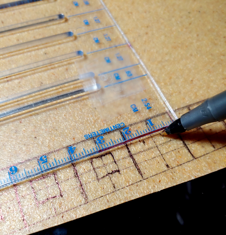 Drawing the square coins using a clear ruler and a pen
