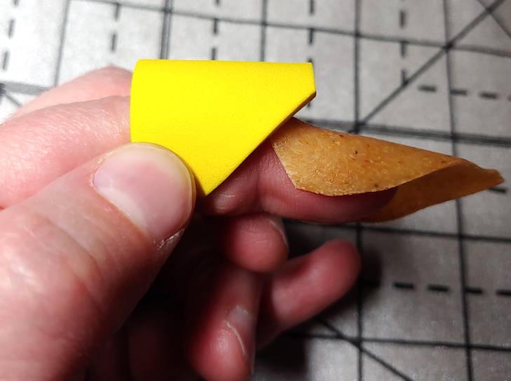 Finger cap pattern in foam next to Worbla fingertips