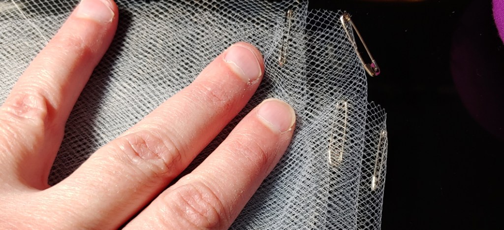 Safety pins slipped into each fold