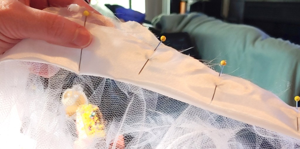 Pinning the waistband to the basting ribbon