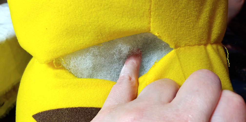 feeling for any gaps in the back of the neck