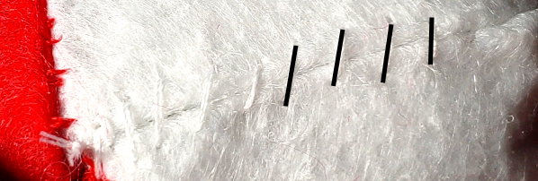 A whip stitch, partially marked in black.