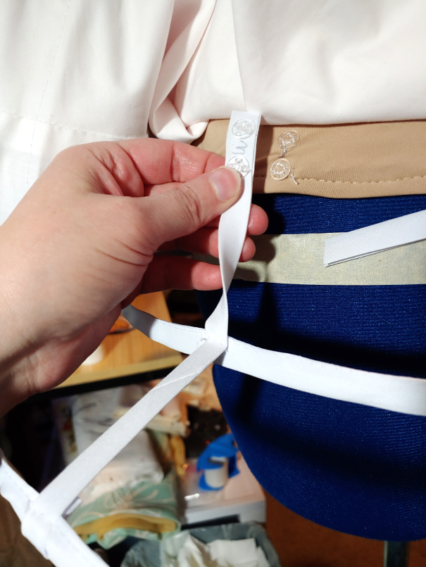 Removable cage showing how the it snaps to the basque