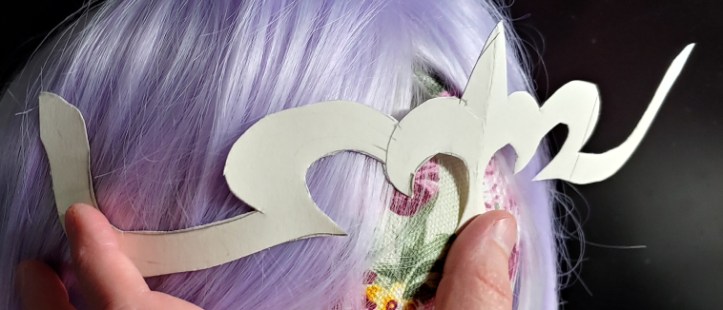 Camilla's crown drawn out in poster board. There is a crease down the center of the fleur de lis where the paper was folded in half.