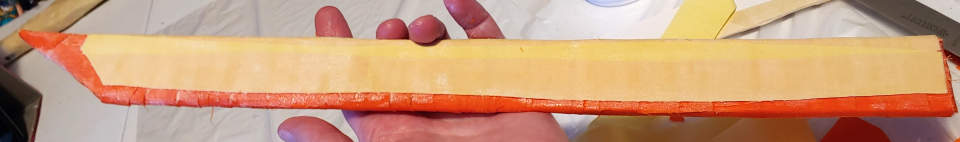 a sword wrapped lengthwise along the blade to minimize the visibility of the strips