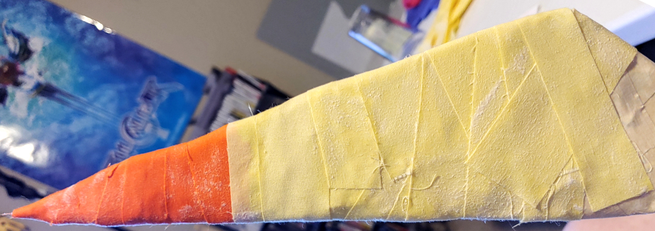 Left side of a wrapped object with consistent straight strips while the right side has more haphazard diagonal wrapping