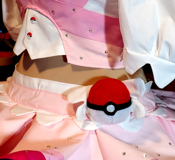 Standard red and white Pokeball with a black band sewn into a waistband of a cosplay
