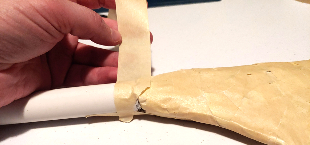 Start wrapping around the connector joint with tape