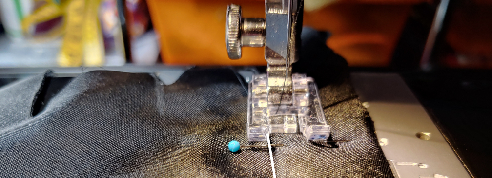 Sewing the roll. Edge is marked in white to make it more visible