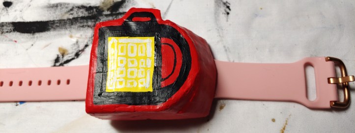 Paper mache poketch (pokemon watch) made of a watch band and taco boxes