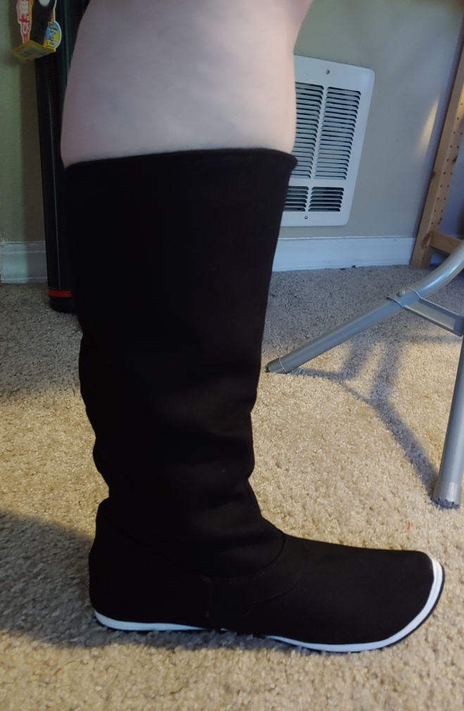 Black hanfu boot squeezing my calf. It won't even go all the way up.