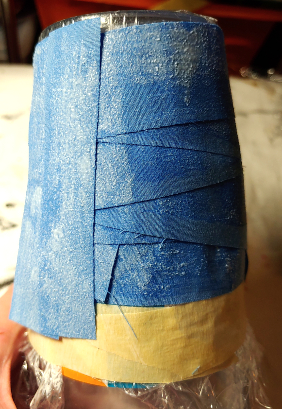 Applying vertical strips over the horizontal strips.