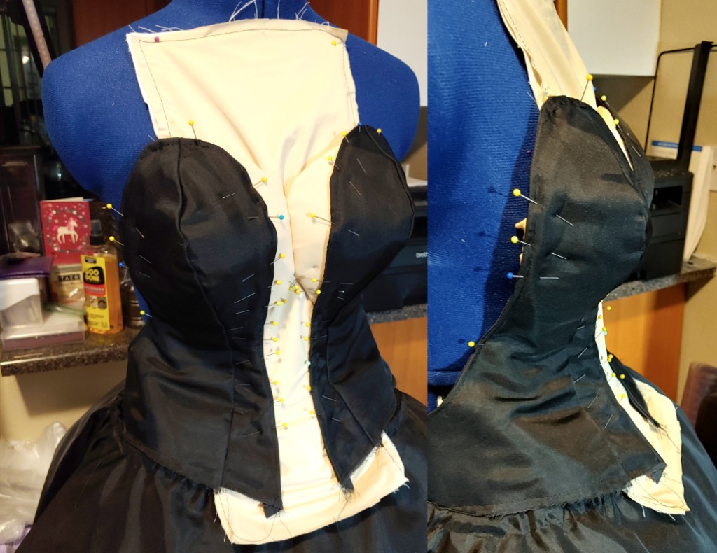 The stability panel and bust pinned to the corset. The stability panel extends beyond the top of the bust and the bottom of the corset and will be trimmed later.