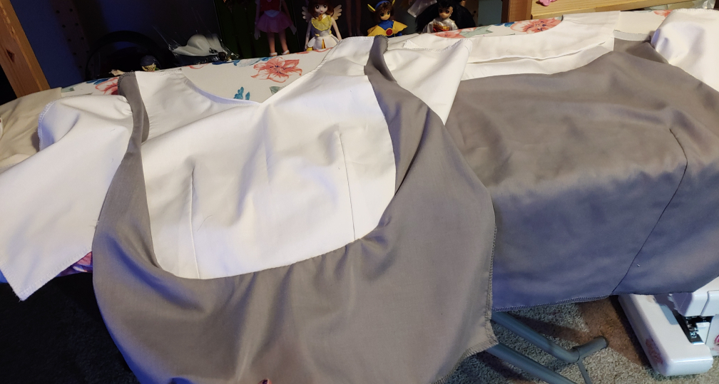 Front (left) and back (right) of Rue's tear-away shirt laying out on an ironing board