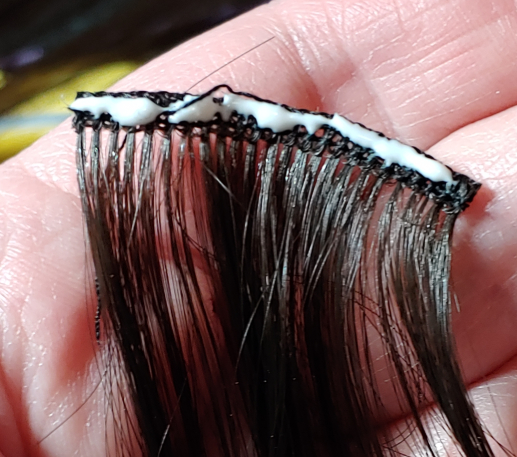 Glue added to the weft only at the top.