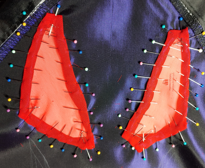 Red kite eyes with chiffon pinned to the cutouts
