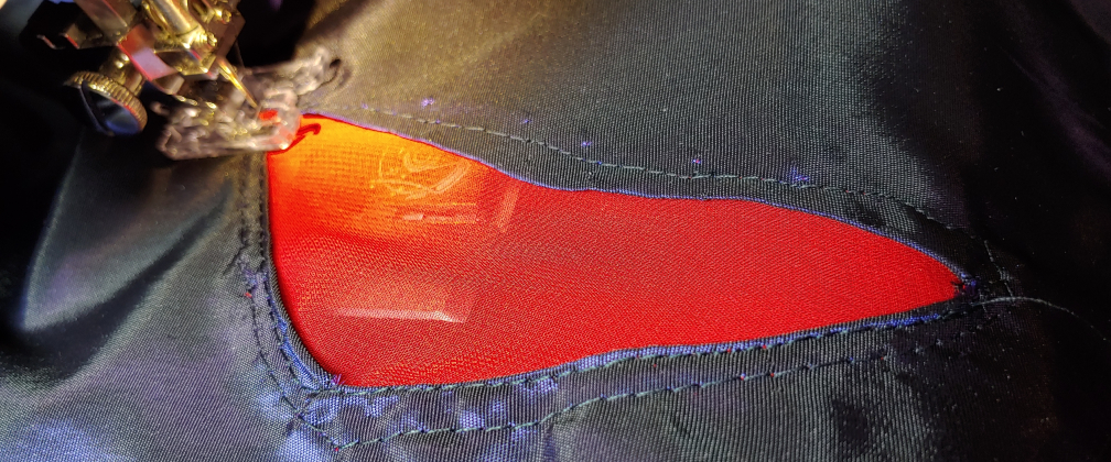 Double stitching the chiffon. The inner stitch is done with the kite face-up to get as close as possible to the edge of the kite fabric