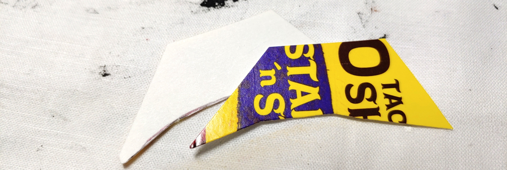 Shape of the side pieces. They're sort of a trapezoid shape with a curved bottom edge. The left side is longer than the right, making a more gentle edge on the left side while the right is more sharp.