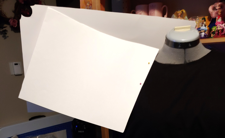 Pinning the front and back pieces to the dress form