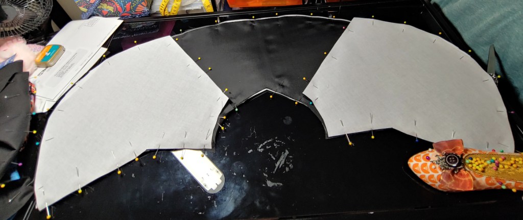 Layered front and back pieces, the front pieces are sitting on the back piece with the buckram-side up