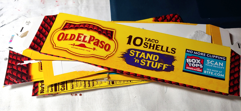 Pile of yellow taco box flaps