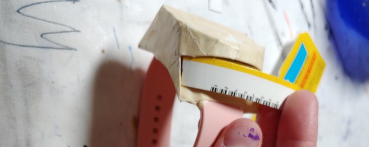 Filling in the gap with strips. The strip is curved, partially tucked into the body to help with placement (and holding the camera at the same time)