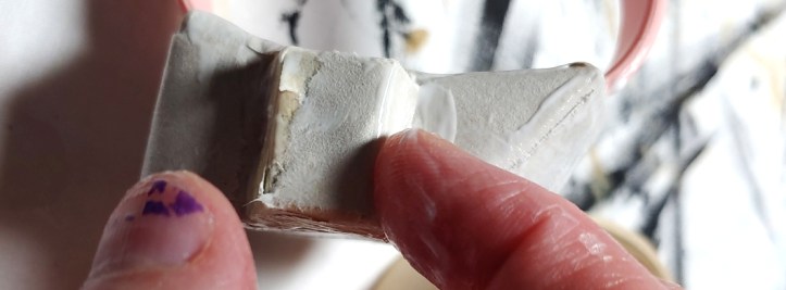 Adding paper mache to the side buttons. Using my index finger to push the paper into the corners to have that nice crisp edge that the food box does.