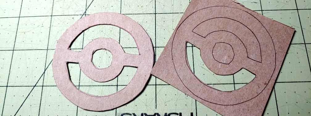 Medallion details cut out. The inner details were cut with a box knife. The box on the left is fully cut while the one on the right only has part of the inner details cut.