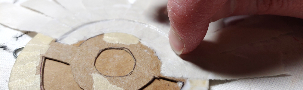 Pushing the paper into the  edges to make a raised detail