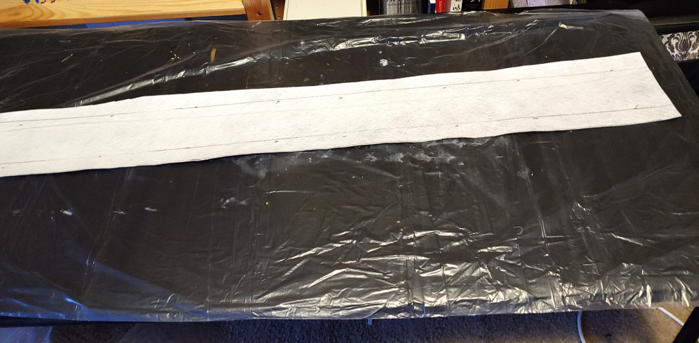 Table protected with a plastic drop cloth