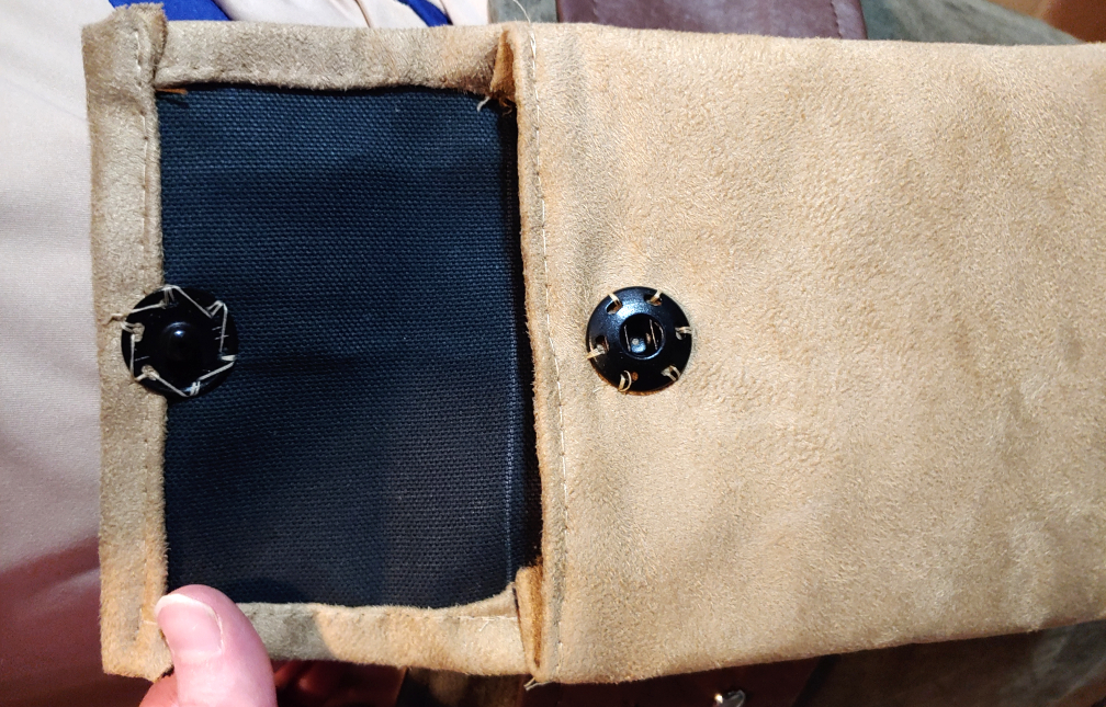 Belt pouch with snaps added. Both snaps are facing forward so that when the flap is folded down, they meet up