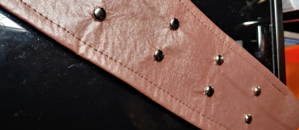 Round studs added to the belt.