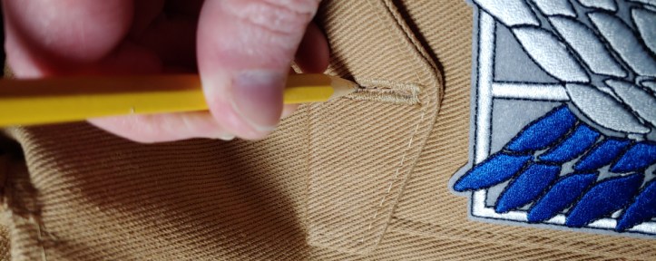 Marking a buttonhole for a pocket (holding hand not pictured because I need to hold my camera)