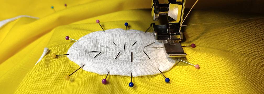 Carefully sewing along the edge with a zipper foot